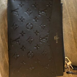 Black Embossed Leather Authentic Louis Vuitton Zip Wristlet bag